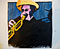 Coloured woodcut of a trumpet player in a yellow hat.